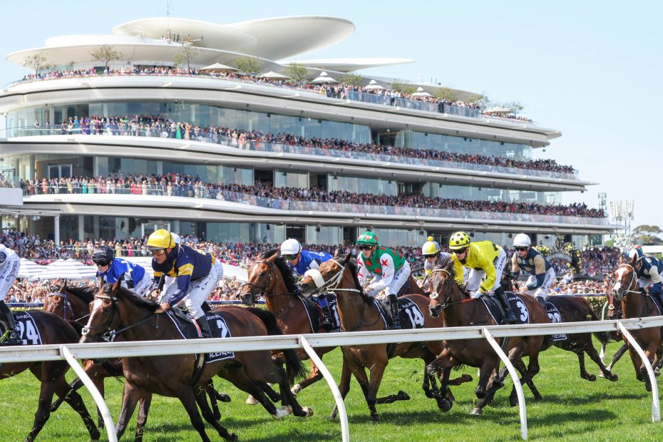 Crowd of Australian race fans watching a thoroughbred return to stables during Sydney race day